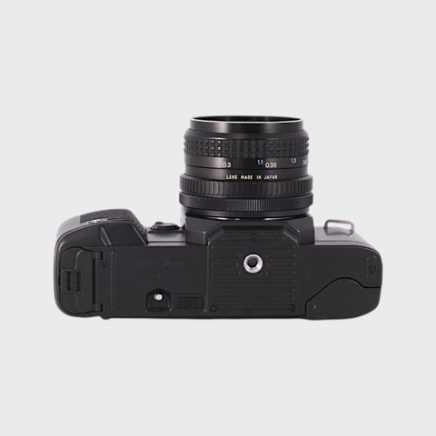 Canon T70 Reflex 35mm argentique avec objectif 28mm f2.8