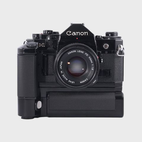 Canon A-1 35mm SLR film camera with 50mm f1.8 lens and motor grip