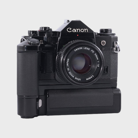 Canon A-1 35mm SLR film camera with 50mm f1.8 lens and motor grip